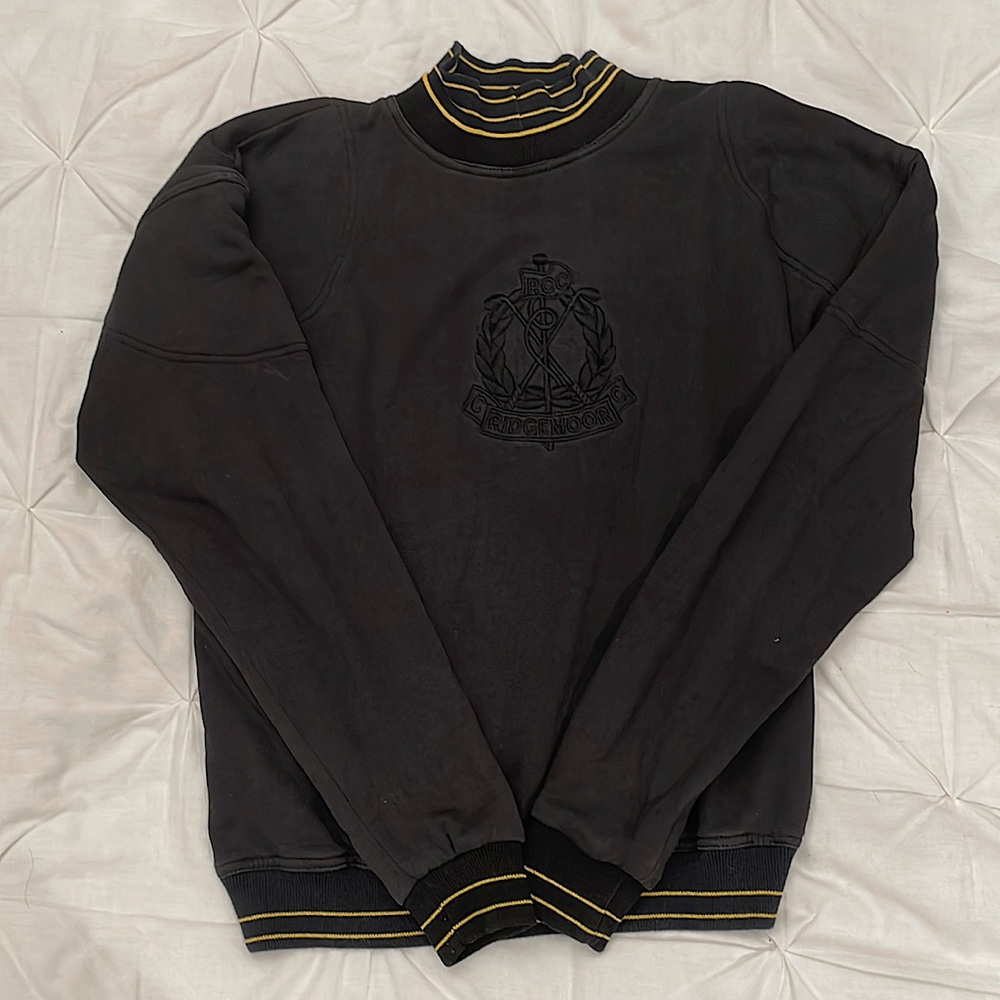 Black sweater with a black & yellow striped mock neck.